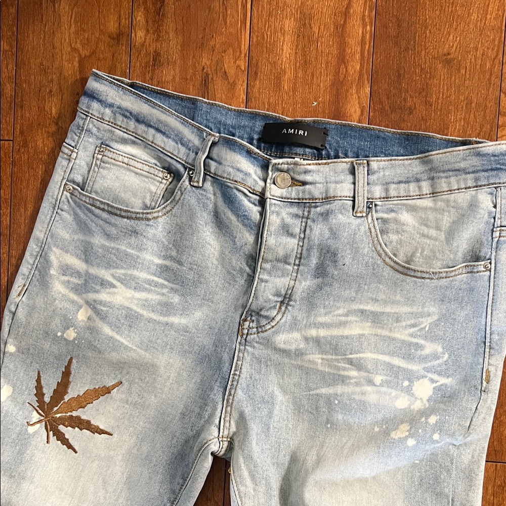 AMIRI Faded Blue Skinny Jeans with Leaf Accent